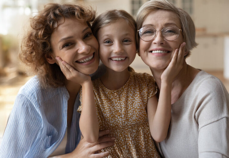 Smiling Young Daughter With Mother And Grandmother