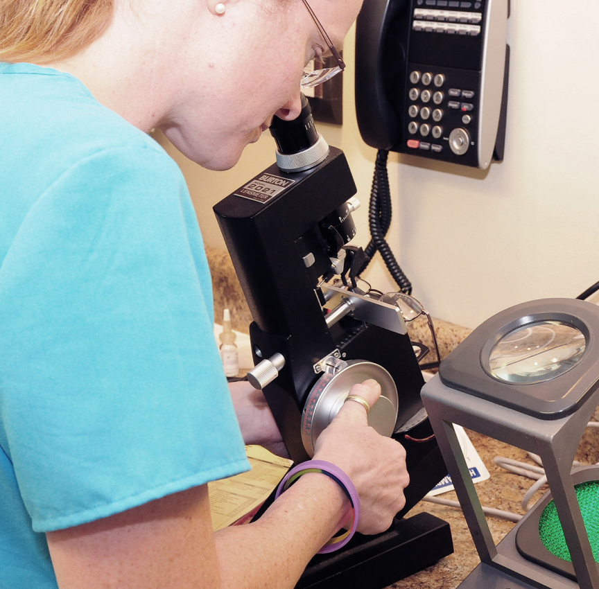 Eye Doctor Looking In Eye Surgical Tool