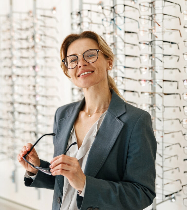 Smiling Patient Trying On Eye Glasses