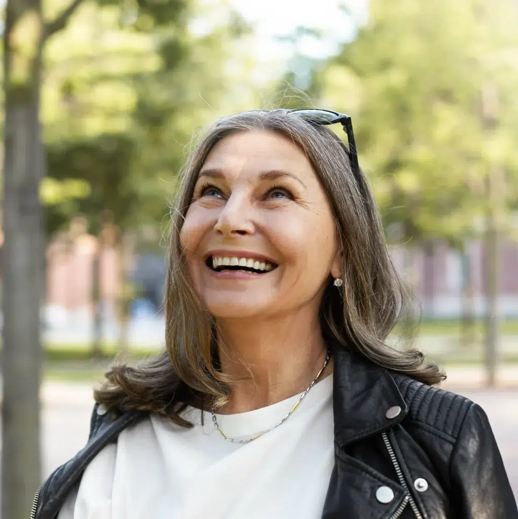 Confident smiling woman outdoors