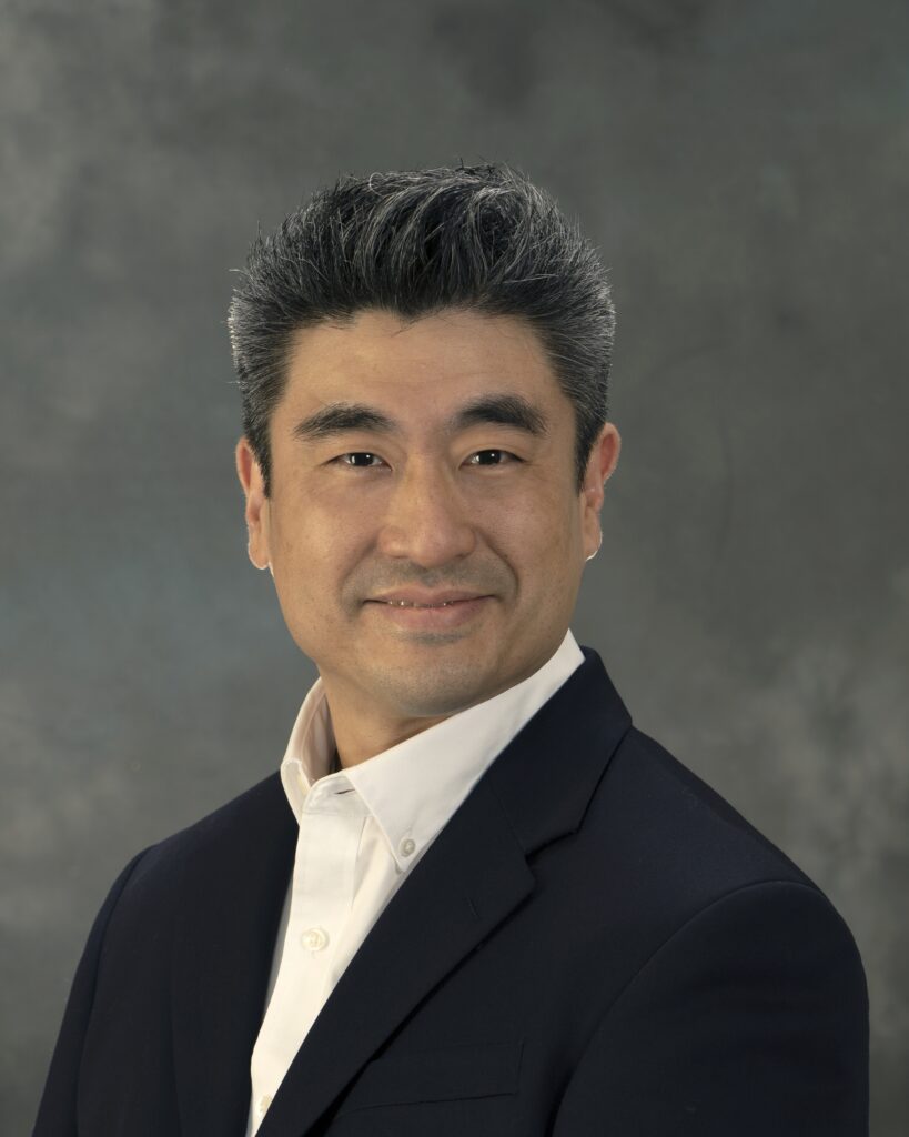 Portrait Of Dr Kim In A Nice Black Suit